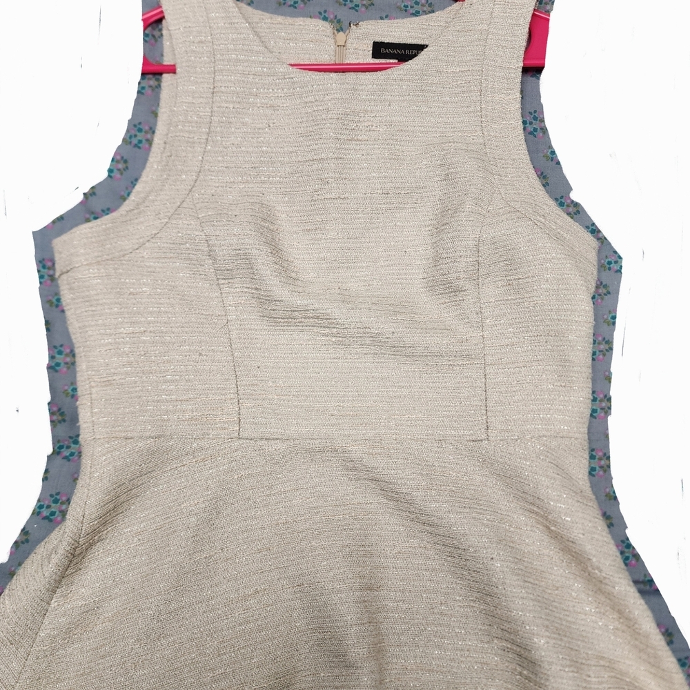 Elegant Cream Sleeveless Peplum Shell